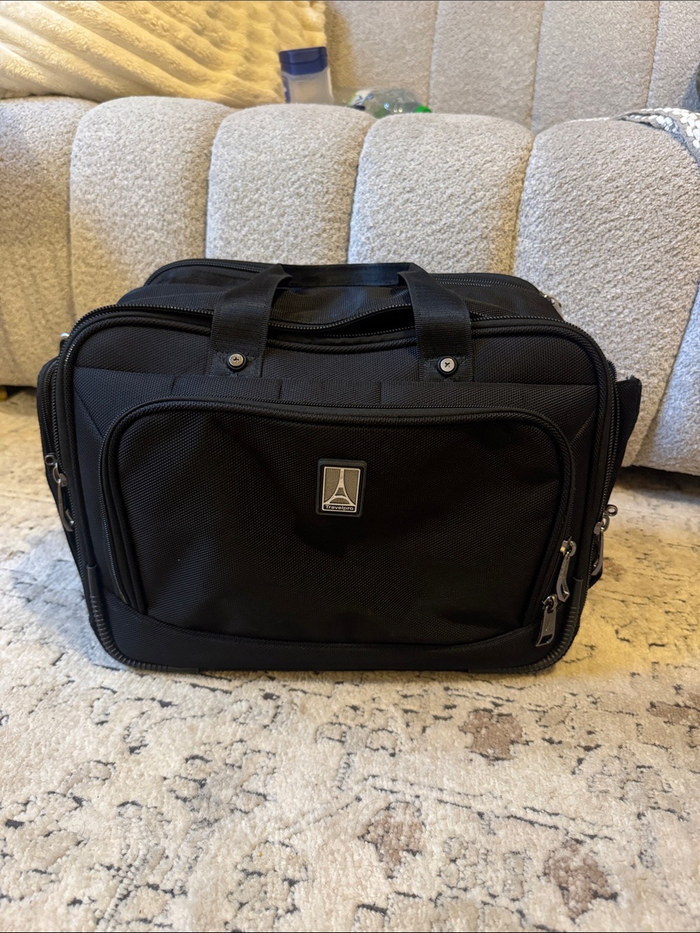 TravelPro Black Women's Toiletry Bag with Front Pocket and Dual Handles